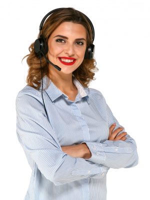 Gorgeous woman in headphones using microphones, hands folded dressed up in blue blouse